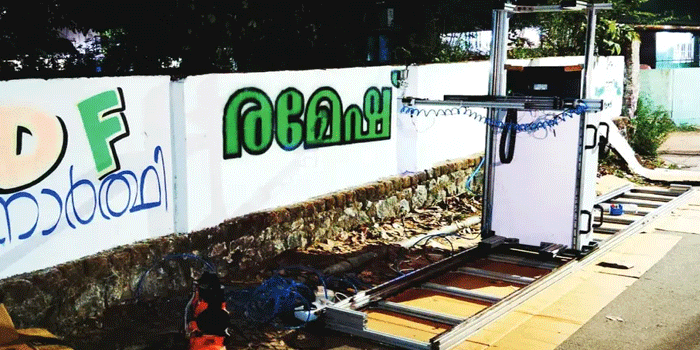 ചുവരെഴുതാൻ ഇനി ആളെ തപ്പി നടക്കേണ്ട; ഏതു നിറത്തിലും ഭാഷയിലും എഴുതി തരാൻ ‘ചുവർബോട്ട്’ റോബോർട്ട് റെഡി!