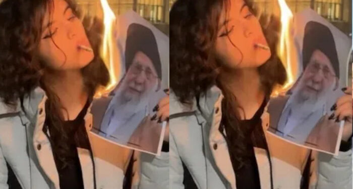 ഞങ്ങൾ നിങ്ങളുടെ കുഴിമാടത്തിൽ നൃത്തം ചെയ്യുമെന്ന് ഞാൻ പറഞ്ഞില്ലേ? ഒരു എലിയേ പോലുള്ള അവസാനം… ആഹ്ലാദപ്രടകനവുമായി ഖമനേയിയുടെ ചിത്രം കത്തിച്ച് സിഗരറ്റ് വലിച്ച യുവതി